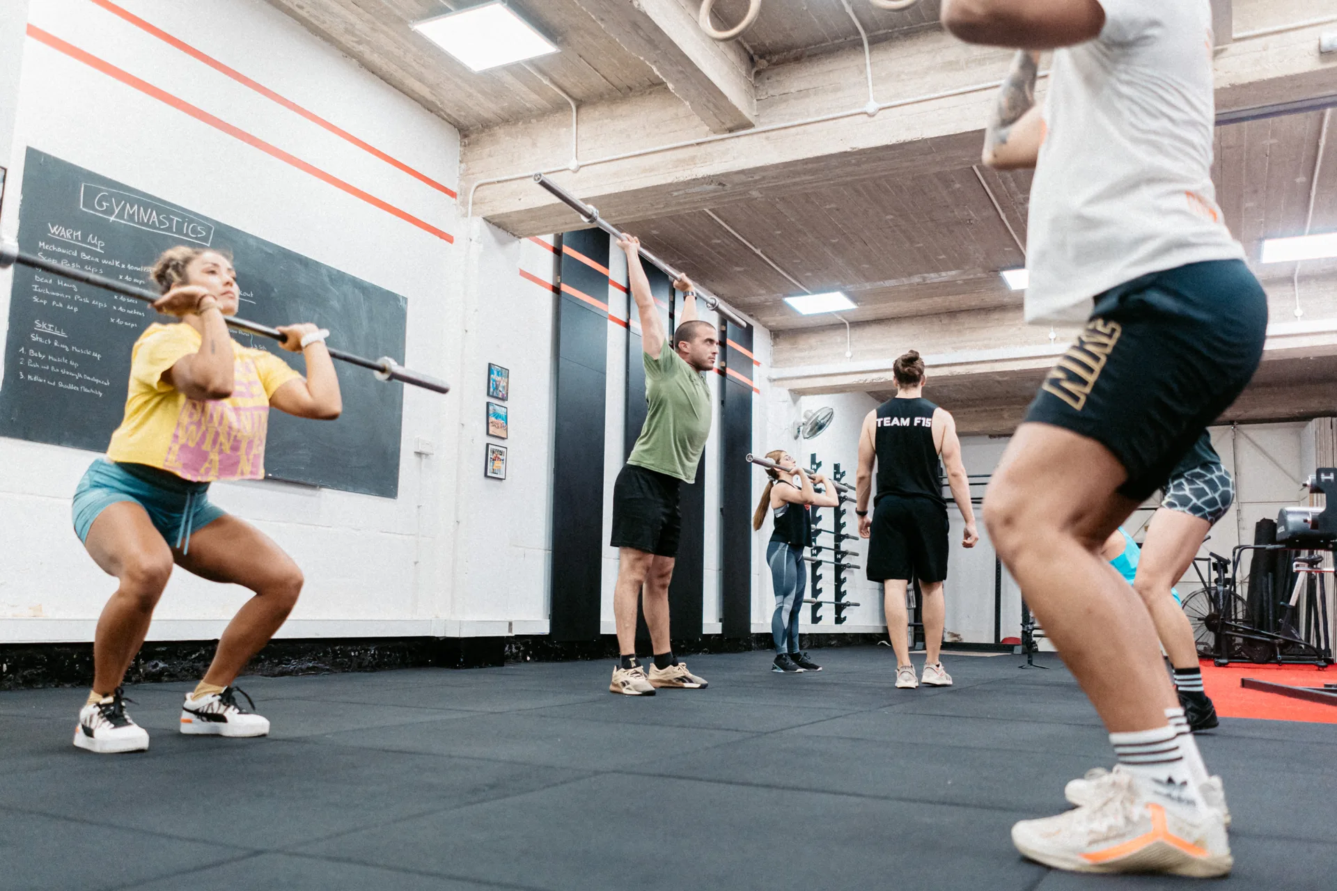 Group CrossFit class training with barbells at F15 gym near Gzira Malta