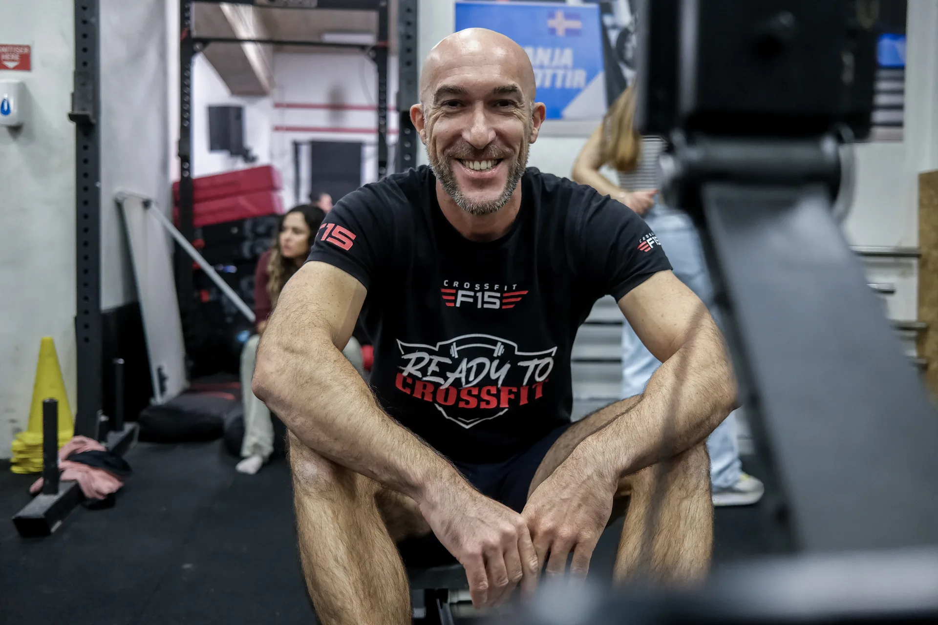Smiling F15 CrossFit coach in Ready to CrossFit t-shirt at Malta gym